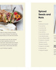 Open cookbook showing a page with a pastrami club and another with spiced seeds and nuts.
