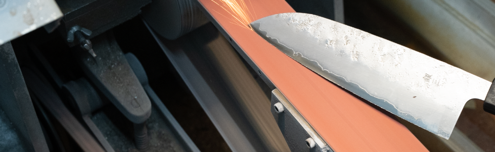 Japanese kitchen knife being sharpened