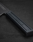 Black knife with 'NATIONALE' branding on a dark background