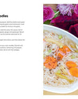 Recipe card for Thai Broth and Rice Noodles with a bowl of noodles and vegetables on a wooden surface.
