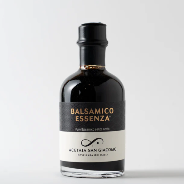 Bottle of Balsamico Essenza with a black label on a white background