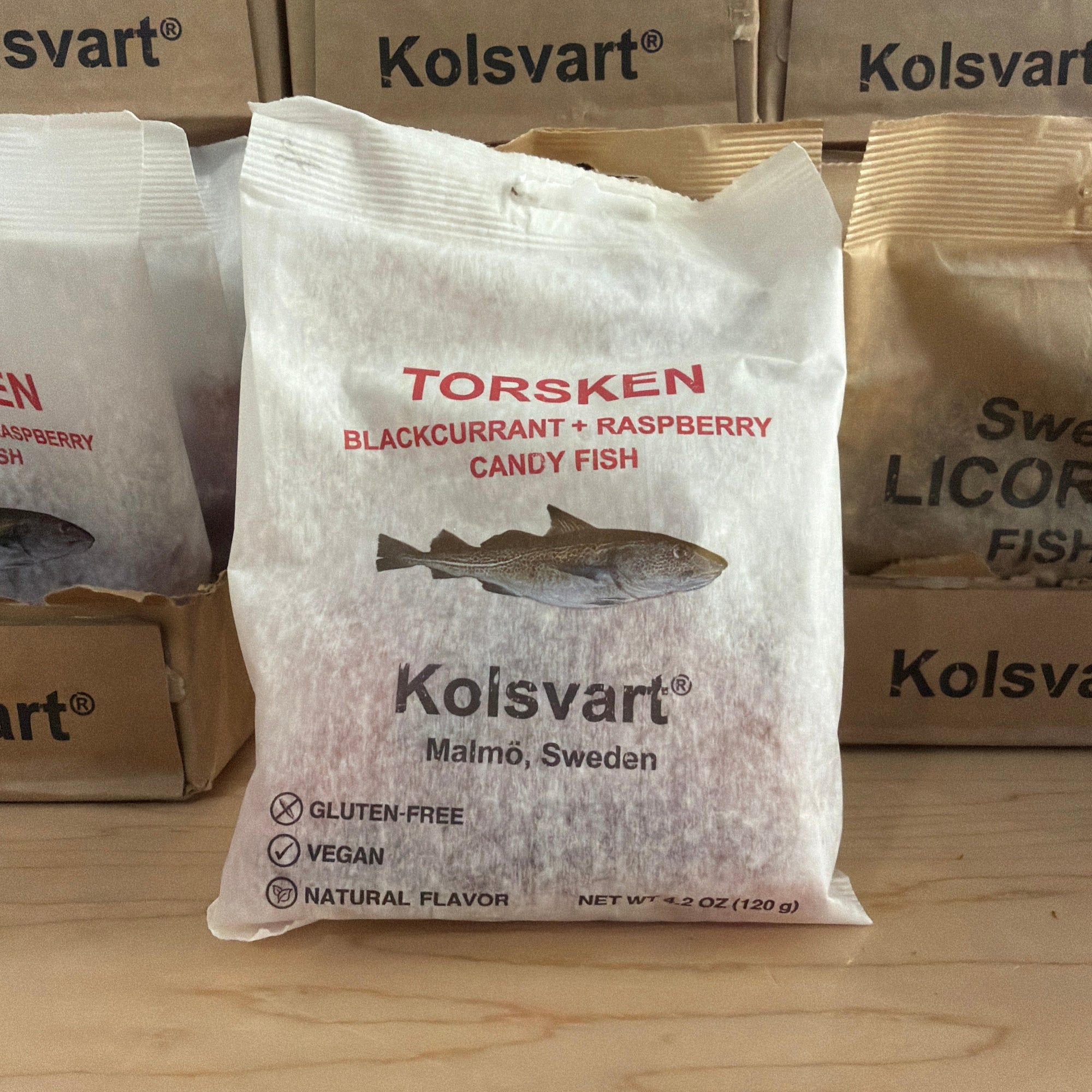 Kolsvart fish packages on a wooden surface