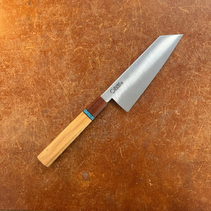 Knife with a wooden handle on a brown surface