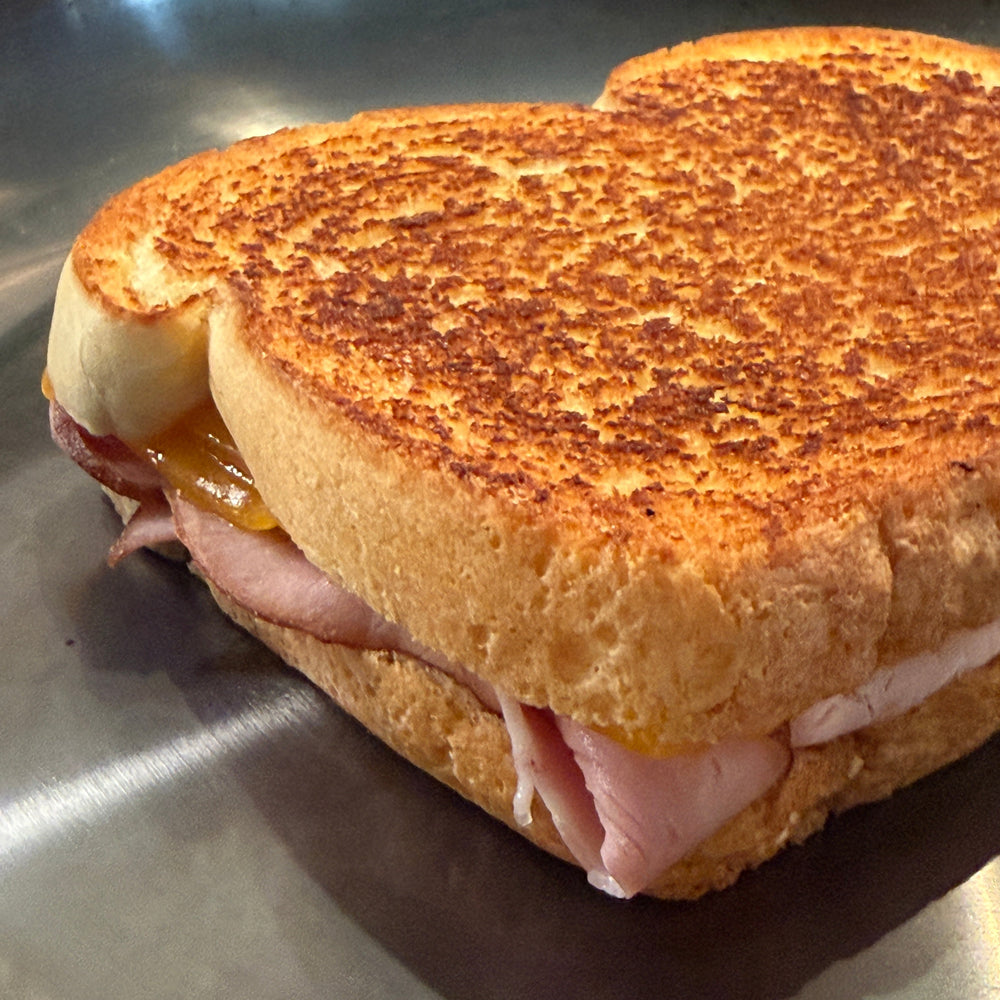 
                  
                    Sandwich with toasted bread on a metallic surface hestan pan cooked with chef press
                  
                