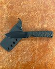 Black knife with sheath on a brown textured surface
