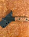 Knife with a wooden handle on a brown leather background uinta