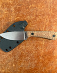 Folded knife with wooden handle and metal blade on a brown surface  Uinta