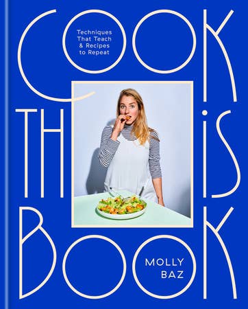 Cookbook cover with a woman holding a plate of food, set against a blue background with white text.
